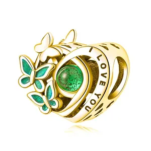 Golden heart charm with green gem, enamel butterflies, and I Love You engraving