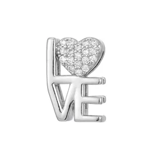 Polished silver LOVE charm with sparkling heart-shaped cubic zirconia inlay