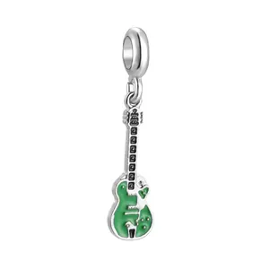 Detail of silver electric guitar charm with green enamel finish for DIY bracelets