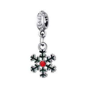 Christmas snowflake charm with green enamel and red crystal in silver metal finish
