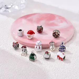 Christmas themed charm beads set with Santa, snowmen and trees in colorful enamel