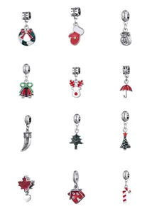Macro shot of 12 silver Christmas charms with colorful enamel and sparkling crystals