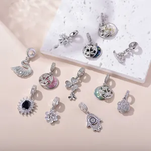 Exquisite copper cubic zirconia charm collection with swan and clover designs