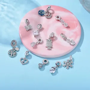 Silver-plated charm collection with sparkling cubic zirconia and heart snowflake pendants