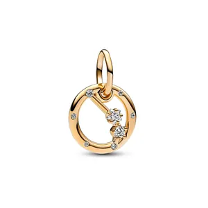 Detail of gold constellation charm with sparkling star-shaped crystals and zircons