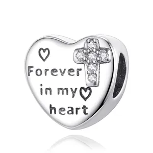 Silver heart charm with Forever in my heart engraving and pave zircon cross detail