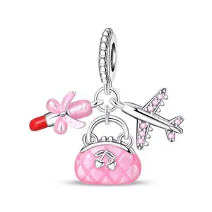 Detail of DIY charms featuring enamel lipstick, pink quilted handbag, and zircon aircraft