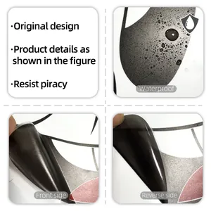 Detail view of waterproof cartoon smile sticker showing front side and adhesive reverse side