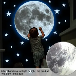 Detailed view of glow in the dark moon and star wall stickers with realistic textures