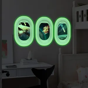 Glow-in-the-dark space window wall stickers showing Earth and planets in a dark bedroom