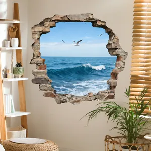 Detail of 3D cracked wall sticker featuring ocean view and seagulls in a cozy living room