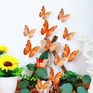 Detail von 3D orangefarbenen Schmetterlings-Wandaufklebern mit Goldrand für Deko