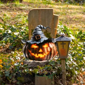 Illuminated Halloween pumpkin lantern with black witch hat for garden decoration