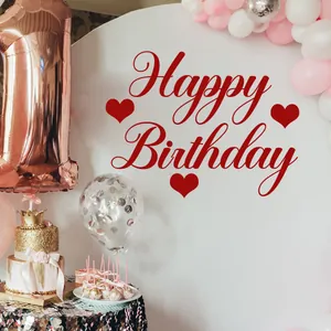Detail of red Happy Birthday wall stickers with heart motifs and pink party decorations