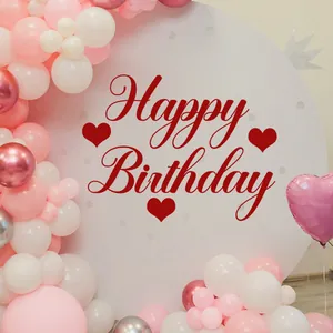 Detailed pink birthday balloon arch with Happy Birthday lettering on a round backdrop