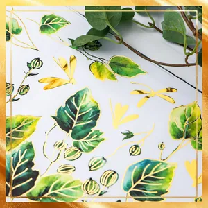 Detail of gilded green leaf stickers and golden dragonfly wall decals with metallic finish
