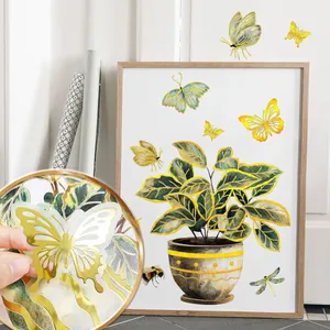 Detail of butterfly wall stickers featuring gold foil accents and intricate hollow-out design