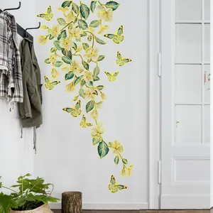 Golden edge floral wall decals with green vines and yellow butterflies in modern home setting