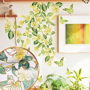 Close-up of gold stamped green vine wall stickers with 3D butterflies for home decor