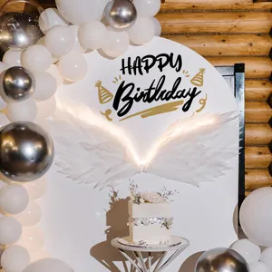 Detail of Happy Birthday wall sticker with LED feather wings and balloon arch decoration