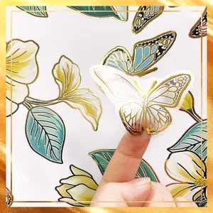 Macro detail of butterfly wall sticker with gold foil accents and transparent backing