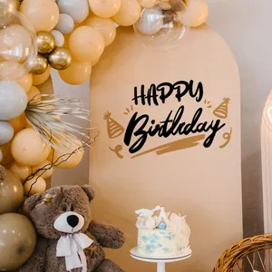 Detail view of Happy Birthday wall sticker on arch backdrop with balloons and teddy bear