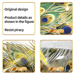Macro detail showing waterproof gold foil peacock feather wall sticker with adhesive back
