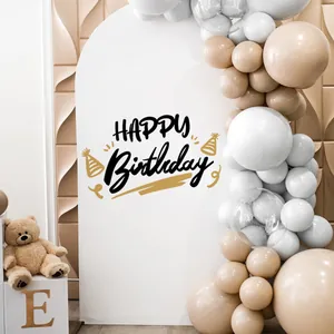 Elegant cream and white birthday party backdrop with balloons and plush teddy bear