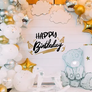 Detail of Happy Birthday party backdrop with gold and silver balloons and wall stickers