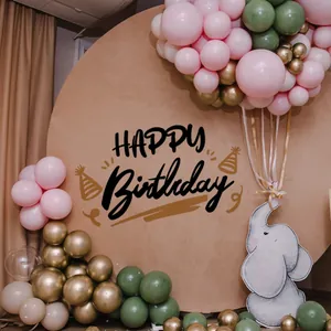 Detail of Happy Birthday backdrop with pink and green balloons and elephant cutout decor