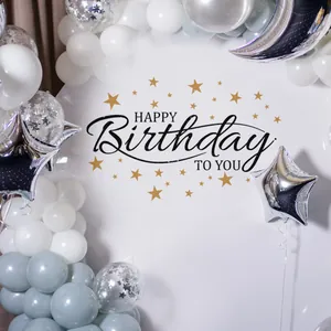 Detail of Happy Birthday backdrop with white balloons and silver star moon decorations