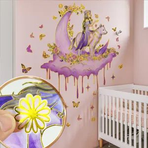 Detail showing gold foil edges and translucent texture of the cartoon moon wall sticker