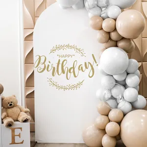 Detail of cream balloon arch and white happy birthday backdrop for party decor