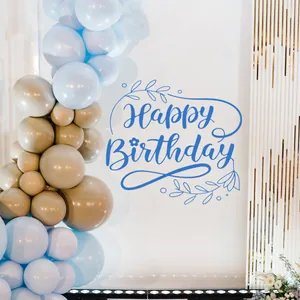 Close-up of blue Happy Birthday wall decal with floral accents for party wall decor