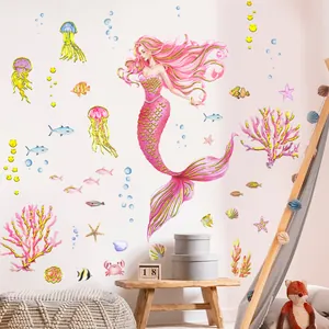 Watercolor mermaid and sea creature wall decals for kids room decor on white wall