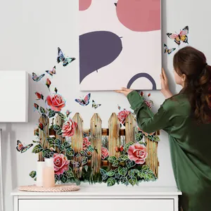 Detailed close-up of colorful floral garden wall decals with wooden fence and butterflies