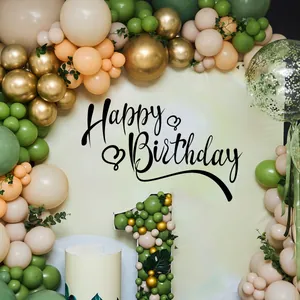 Detail of sage green balloon arch and number one frame for first birthday party setup
