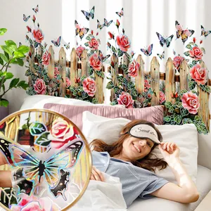 Detail of holographic butterfly wall stickers with roses and a white fence decoration
