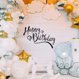 Detail of Happy Birthday backdrop with white wood grain, balloons, and star decor