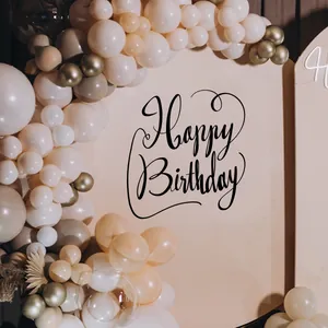 Detail of elegant black cursive Happy Birthday wall decal in a modern balloon party setting