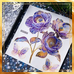 Macro detail of colorful purple flower and butterfly stickers with gold foil outlines