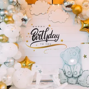 Detail of Happy Birthday wall sticker with golden star balloons and white cloud decor