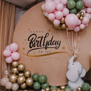 Detail of round Happy Birthday backdrop with gold stars and colorful balloons decoration
