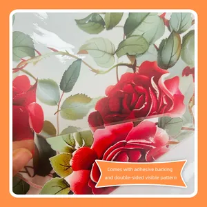 Detail of red rose glass sticker showing self-adhesive backing and double-sided pattern