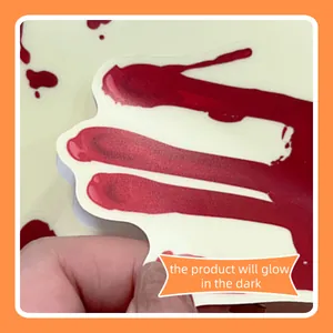Close-up of Halloween glow in the dark bloody handprint stickers for wall decoration
