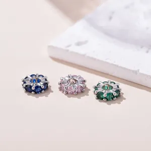 Macro detail of 18k gold plated spacer beads with micro-set colorful zircon stones
