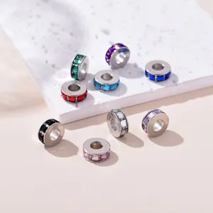 Detailed macro view of colorful rhinestone spacers for DIY jewelry bracelet making