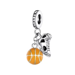 Detail of basketball and sneaker charms for bracelet with 925 silver finish and zircon stones