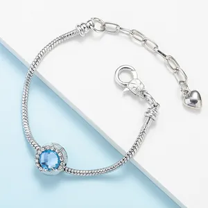 Bracciale a catena serpente in argento con cristallo blu e ciondolo a cuore