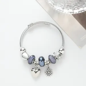 Silver sunflower heart charm bracelet with grey glass beads and clock pendant detail